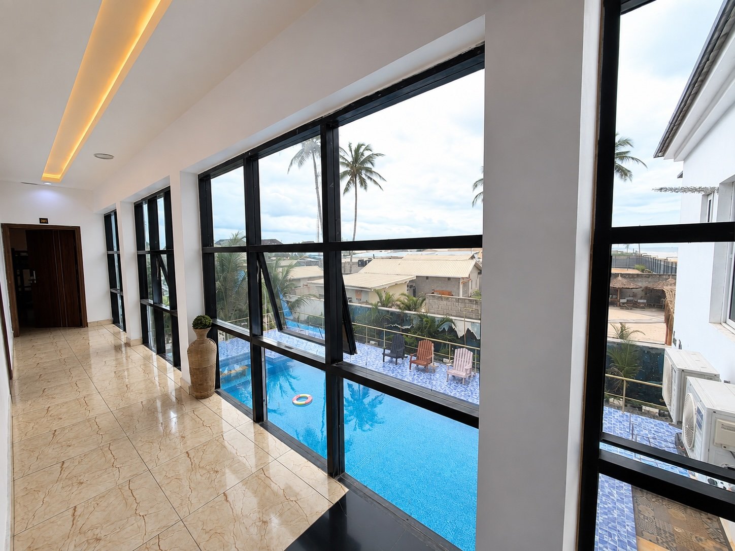 Corridor overlooking the swimming pool at Jet Beach Club