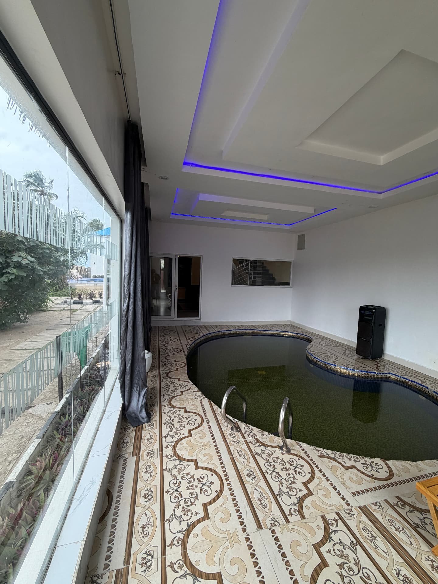 Second bedroom with king bed and air conditioning in the 2 Bed pool apartment